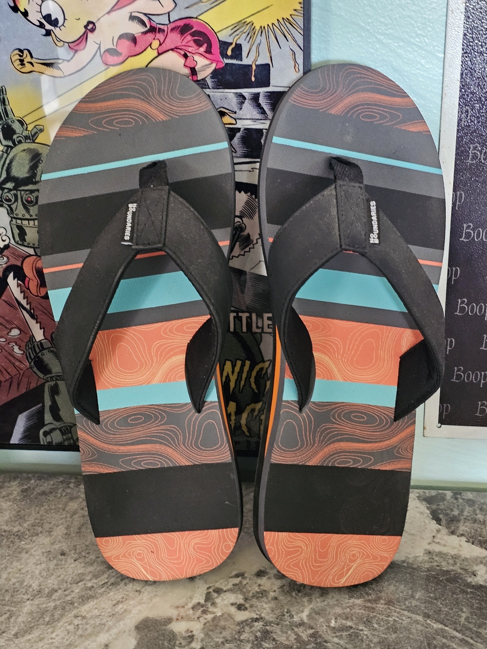 No Boundaries Men’s Black Flip-Flops with Orange and Teal Stripes